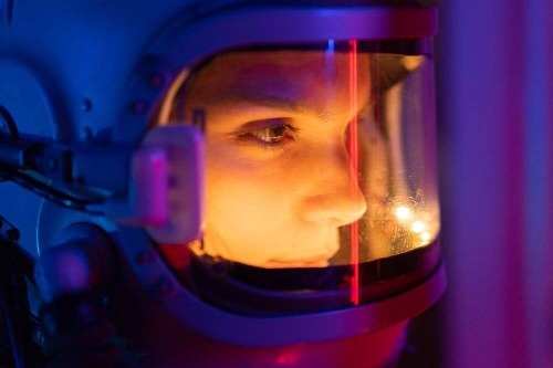 woman astronaut facing right